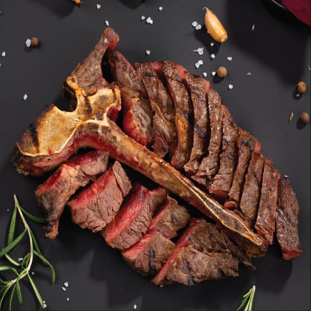 T-Bone Porterhouse grilled and sliced showing both filet and striploin